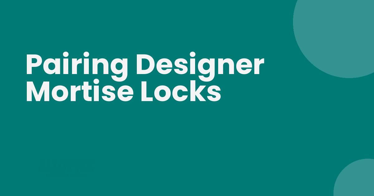 Designer mortise locks with brass lever handles fitted on a solid wood door